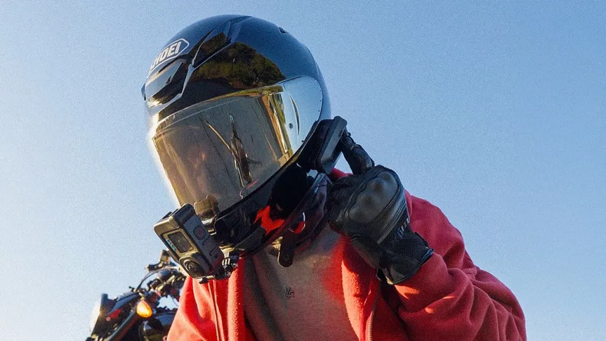 Close-up of the Cardo intercom mounted on Braeden's Shoei helmet